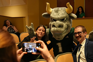 Rocky D Bull with students at the 2026 USF Undergraduate Strategy Competition