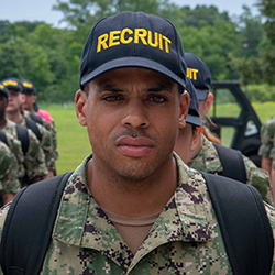 US military recruit in cap and backback