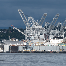 Ship being repaired in Puget Sound Shipyard showing Gantry Cranes