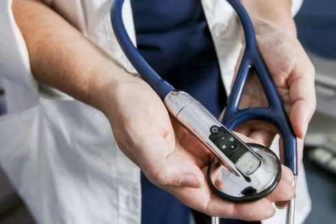 A physician holding a stethoscope