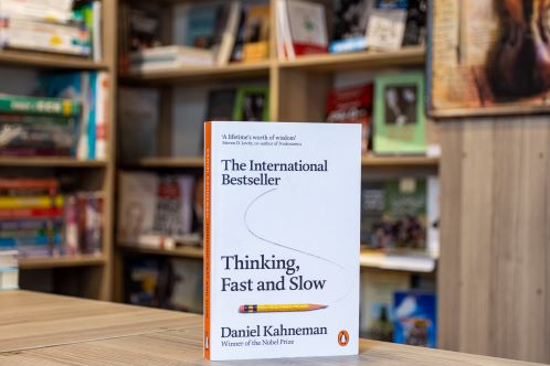 Copy of book, Thinking Fast and Slow, in library