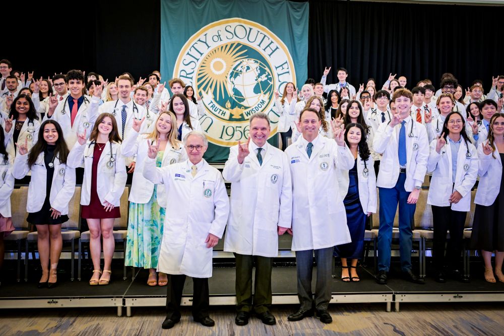 The MCOM Class of 2030 after receiving their white coats.