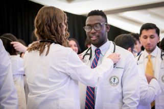 Student receiving White Coat