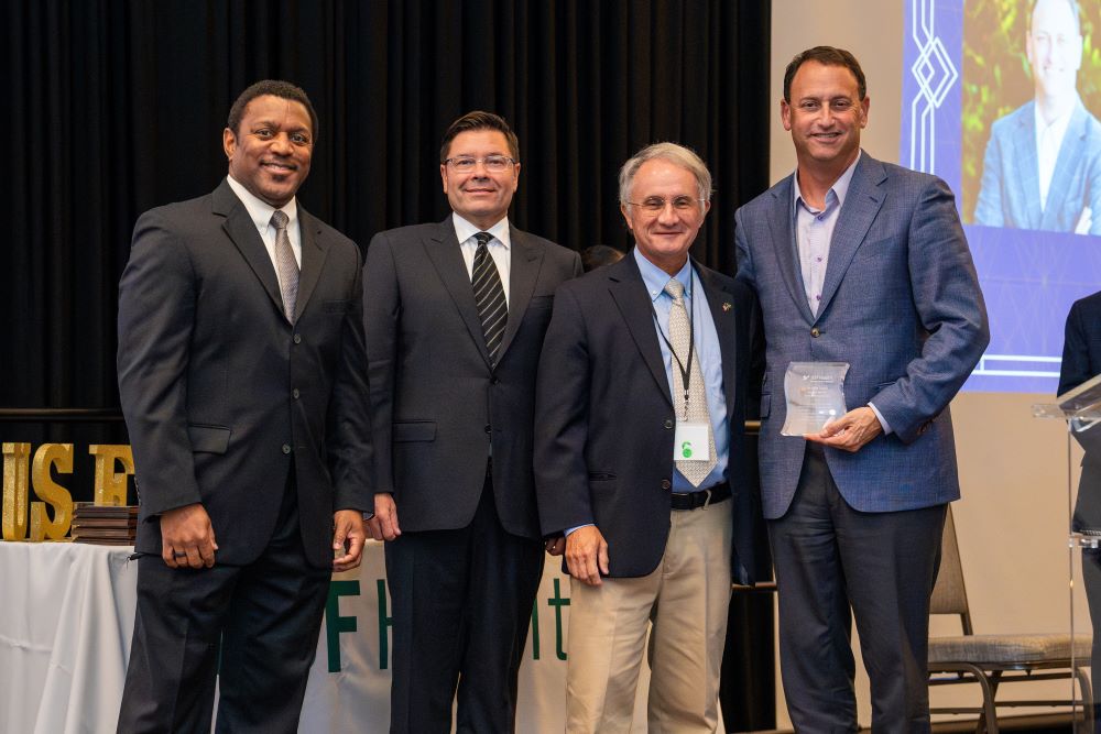 Several awardees at the event include, from left, Dr. Kevin Sneed, Dr. Guilherme Oliveira, Dr. Charles Lockwood and John Couris.