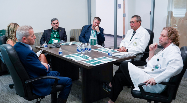 Florida House Speaker Paul Renner (left) receiving a briefing from Harry van Loveren, MD, and Joseph Dituri, PhD.