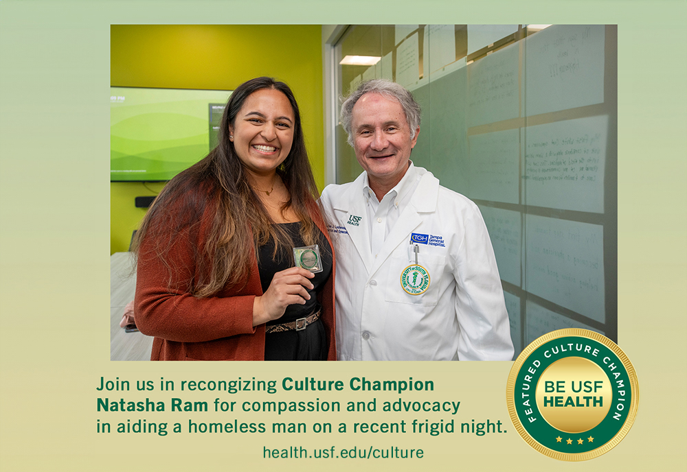 MCOM Student Natasha Ram earns USF Health Culture Coin from Dr. Charles Lockwood