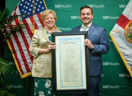 President Law & Representative Anderson holding the Sunshine Genetics Act