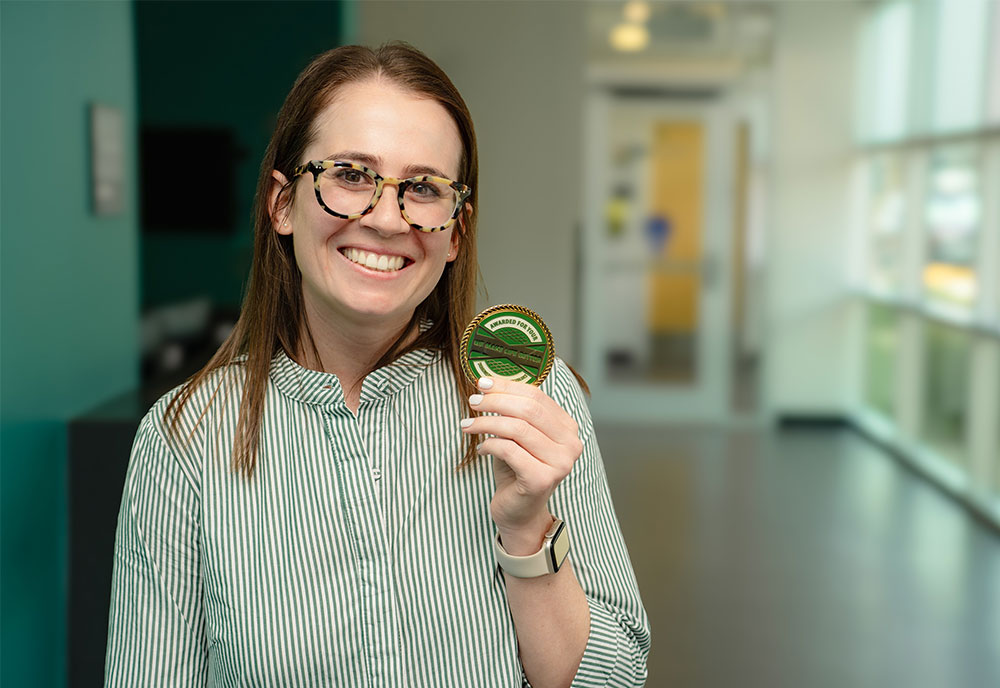 Nicole Misner holding culture coin