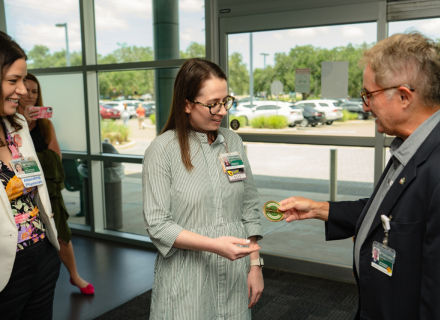 nicole misner recieving culture coin by Dr. Lockwood