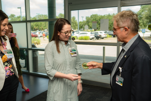 Nicole Misner holding culture coin