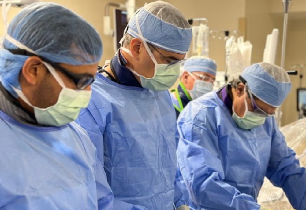 Three surgeons in operating masks
