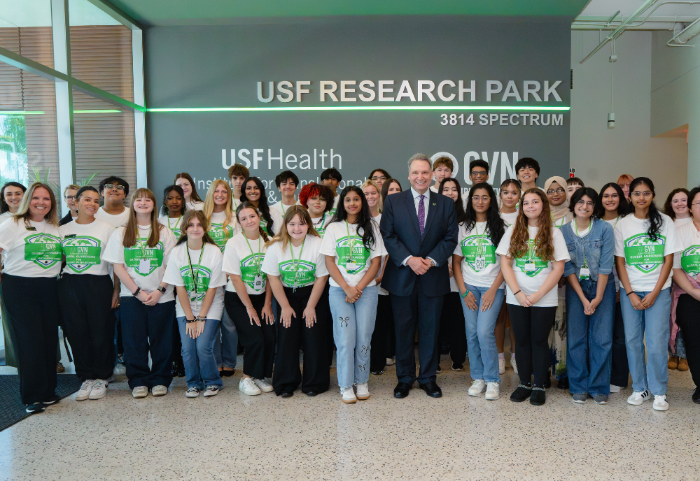 30 high school students in GVN tshirts and USF President Limayem