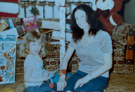Larson has a child sitting with her mother. 