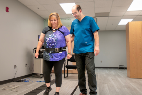 USF Health Amir Tabatabaei helping research participant Angela Arroyo through physical therapy exercises