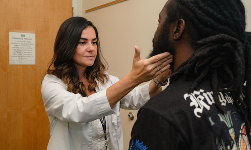 Dr. Pejcic examines a patient