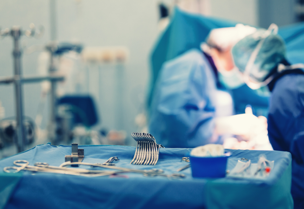 Surgical nurse pick up sterile instrument in the surgery operation room in hospital processing technician and surgical instrument technician, surgical technician operating room technician nurse. 