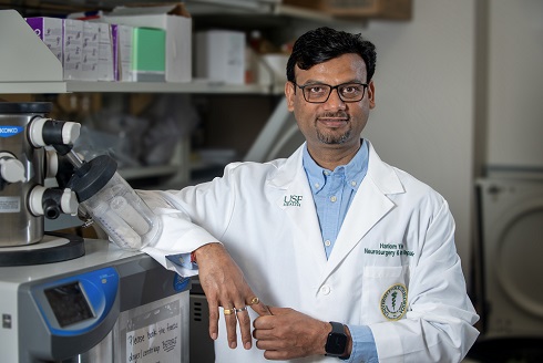 Dr. Hariom Yadav stands in his lab. 