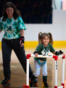 Staff and families having fun at Retro Skate Party