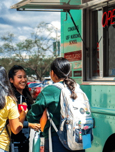 Students in line for ice cream truck.