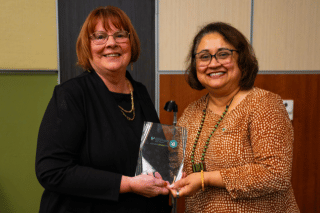 Dean Usha Menon presents Dr. Michaela Shafer with a plaque for being our The Alexander and Victoria L. Rich Distinguished Lecturer.