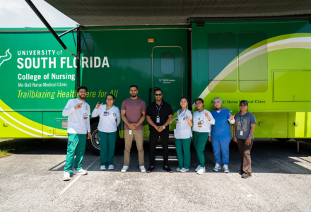 Delima (center) with students from the College of Nursing and his team at Gulf Coast JFCS