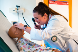 Rebecca Koerner asseses a simulation manikin.