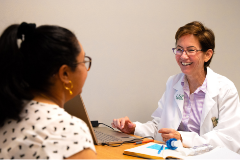 Sandra Morgan explains exercise to study participant.