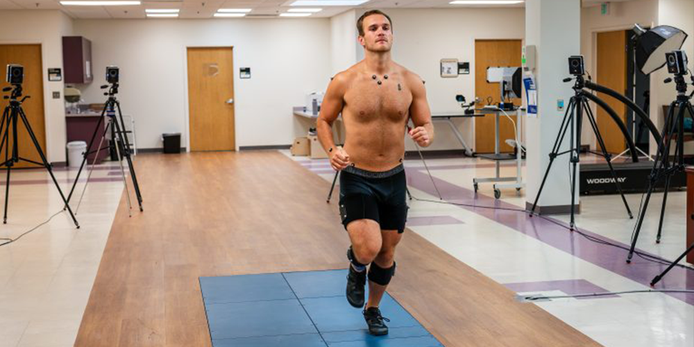 Person running with cords attached