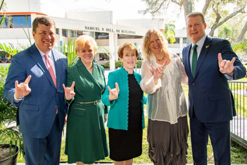 USF college of public health Dean Peterson poses with President Law and Others