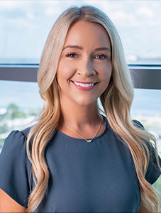 woman posing for headshot.