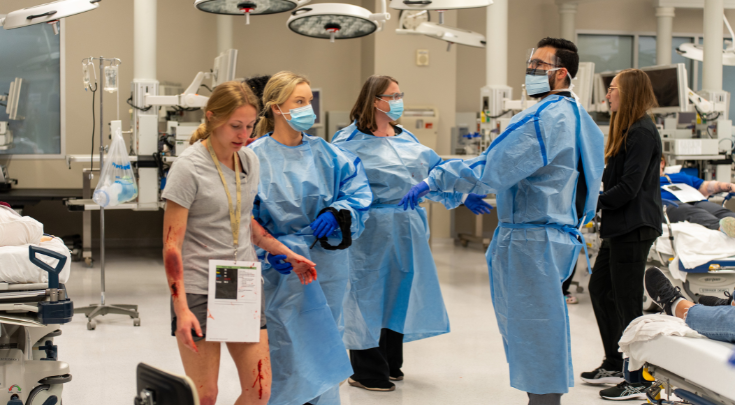 students scrubbing up in hospital setting