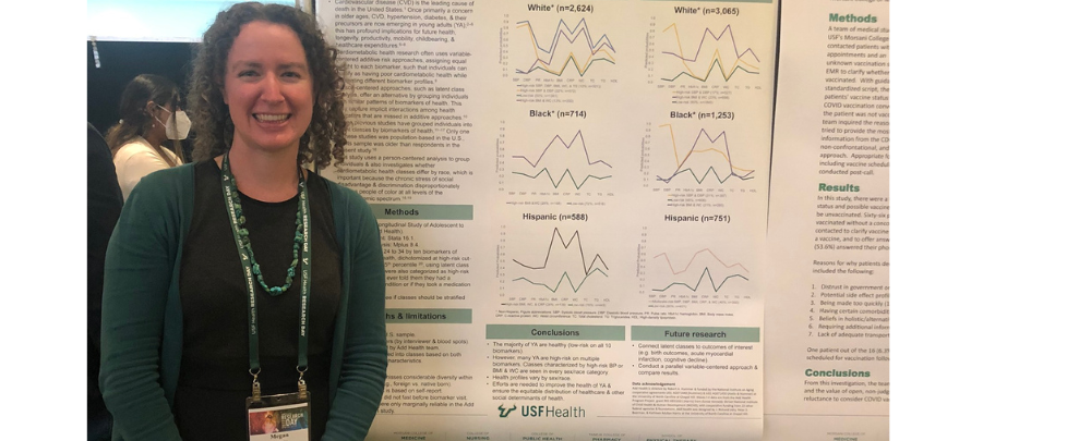 woman standing in front of research poster