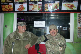 two men posing with a flyer