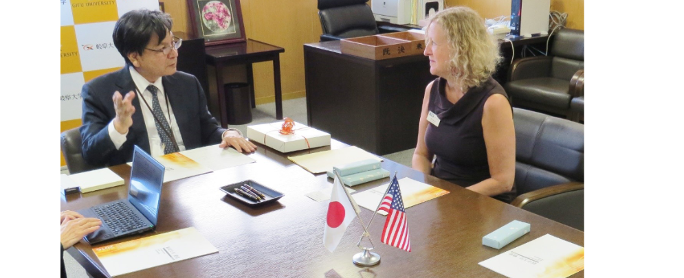 dean petersen with gifu university adminstrator at table