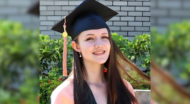 white woman in graduation cap