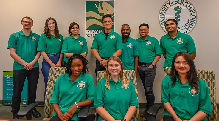 group of students wearing green shirts