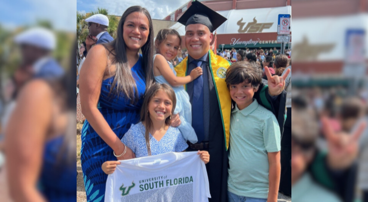 a graduate and his family
