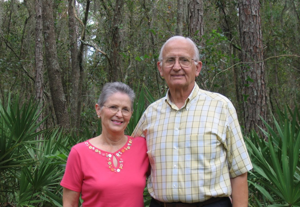 elderly man and woman in forest