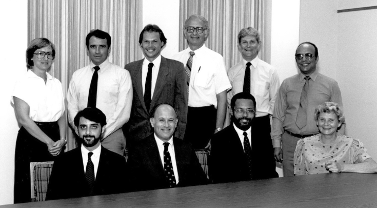 group of men and women in the 1980s