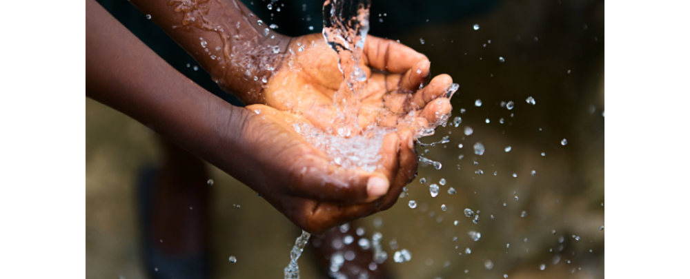 hands being splashed with water