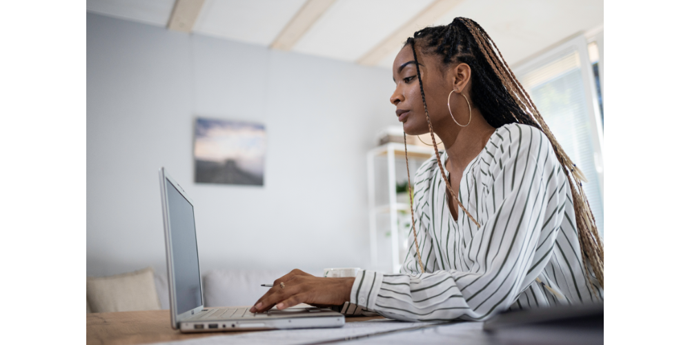 African-American woman looking at computer