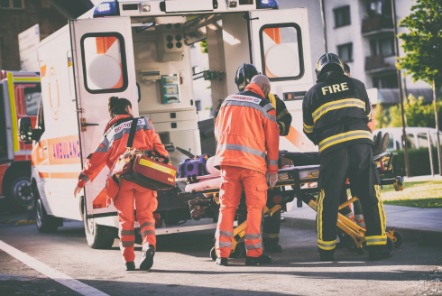 EMS and firefighters running to ambulance