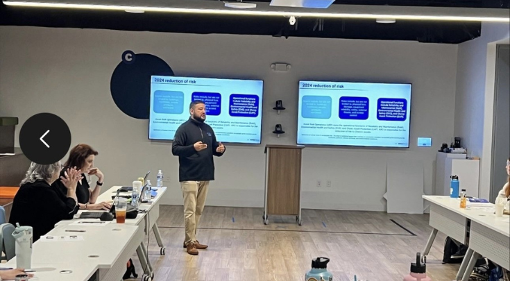 a man presenting in a meeting