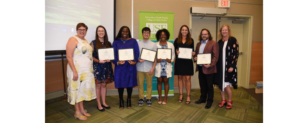 students at delta omega ceremony