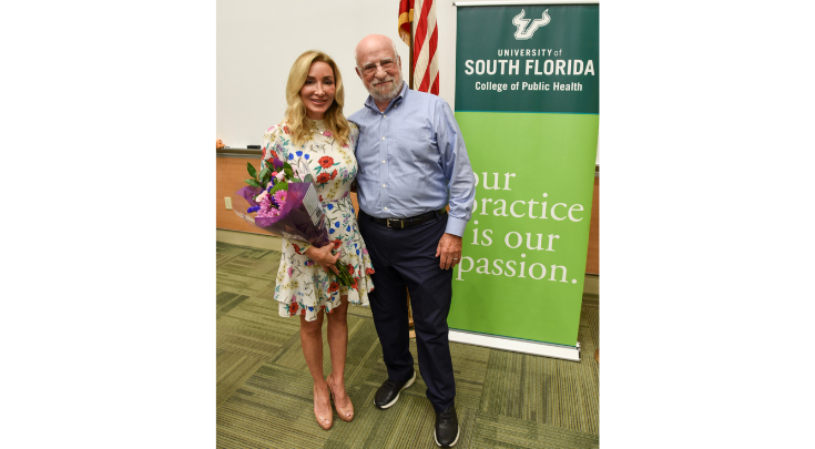 woman holding flowers with older man