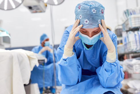 Sad nurse in hospital setting