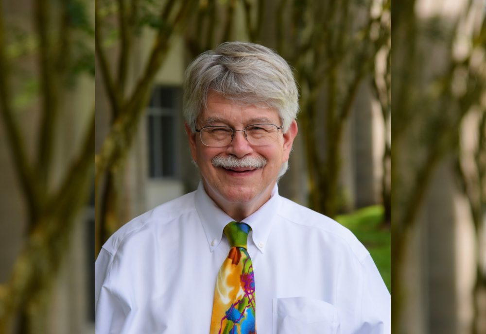 man wearing multi-colored tie
