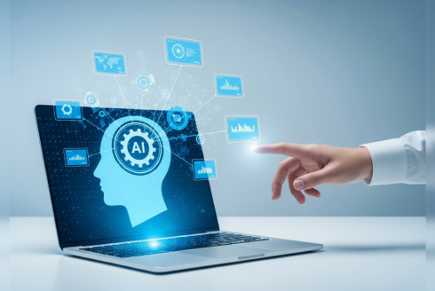 A hand pointing at a representation of AI on a laptop screen.