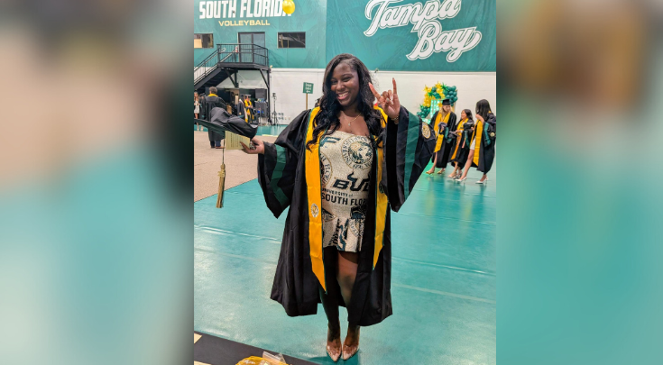 a grad smiling