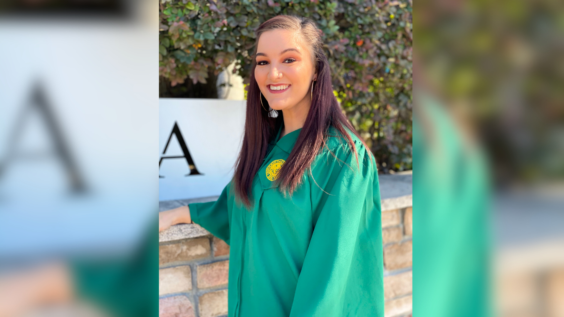Lindsay Thomas in her graduaton gown.